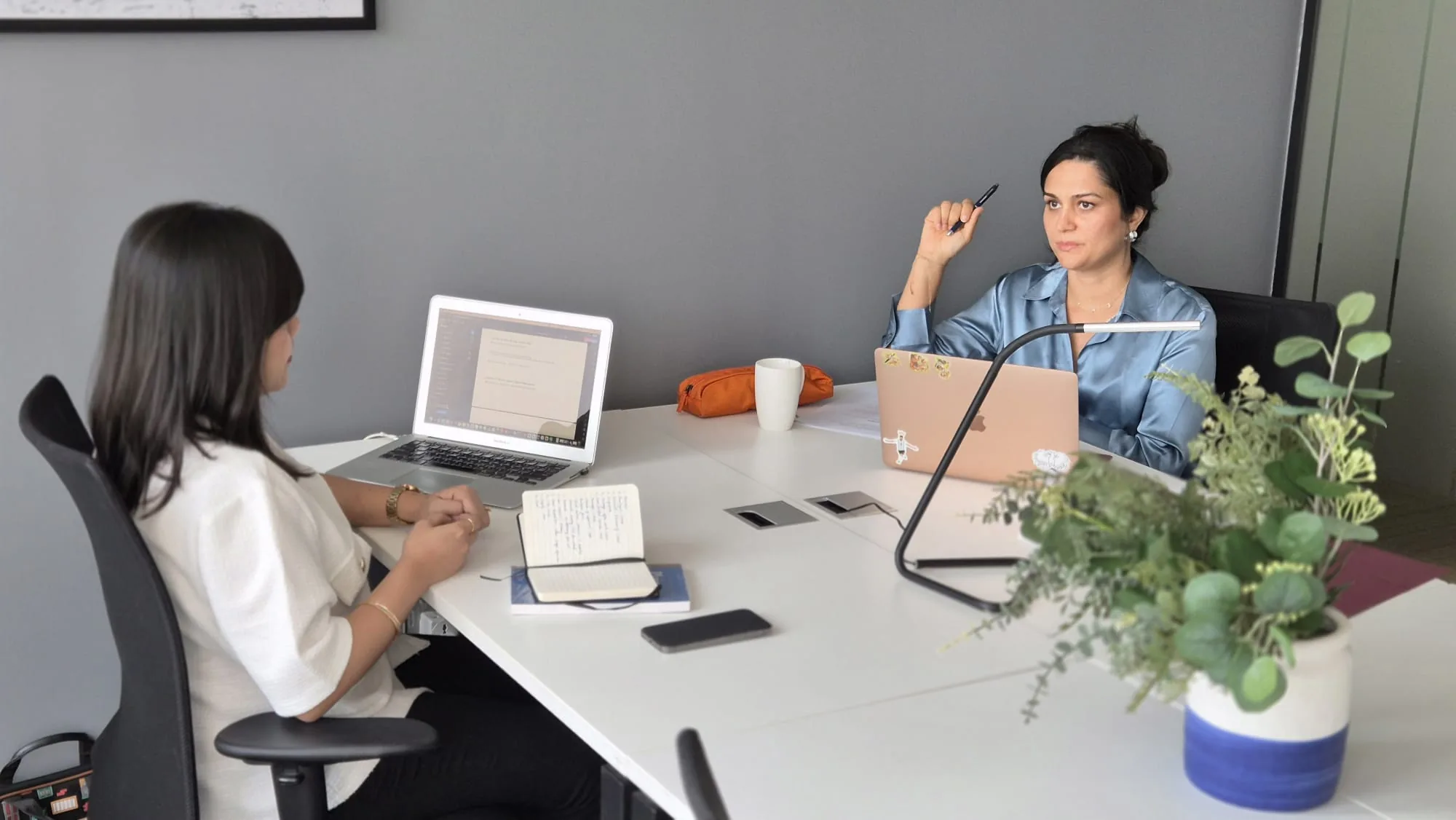 The HBM Law team meeting with a client across the table