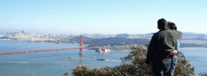 couple looking at the golden gate bridge together