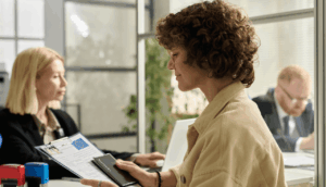 smiling young woman holding approved visa